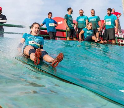 bigstock-Athletes-Sliding-To-Mud-And-Wa-205376923